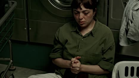 wistful day for young latina in laundry room, emotional narrative
