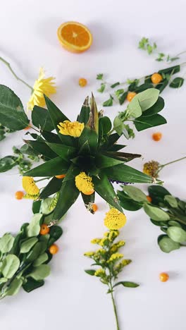 floral arrangement with pineapple and fruits
