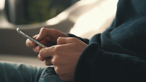 male hands using a smartphone