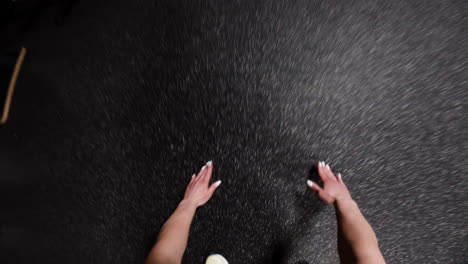 Person's Hands on a Gym Floor