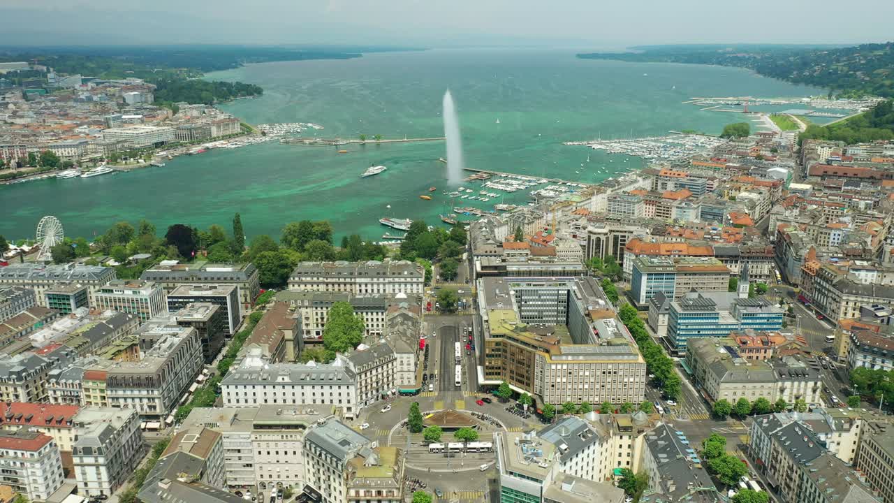 flight over sunny day geneva city lakeside fountain traffic street circle aerial panorama 4k switzerland