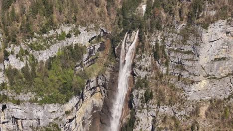 drone aerial view captures the majestic seerenbachfälle, a spectacular series of waterfalls nestled in the amden-betlis region near lake walensee, switzerland