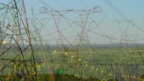 road traffic and electricity pylons 4k