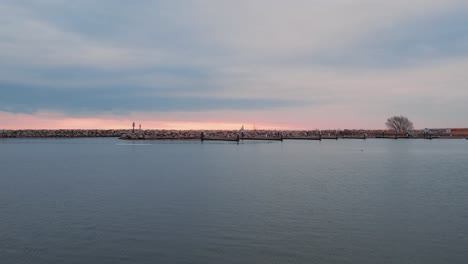 milwaukee breakwater light, captured at sunrise, historical landmark in wisconsin, cinematic shot