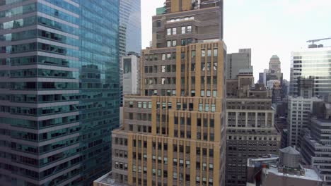 Aerial-birds-eye-overhead-top-view-of-tall-office-of-apartment-buildings