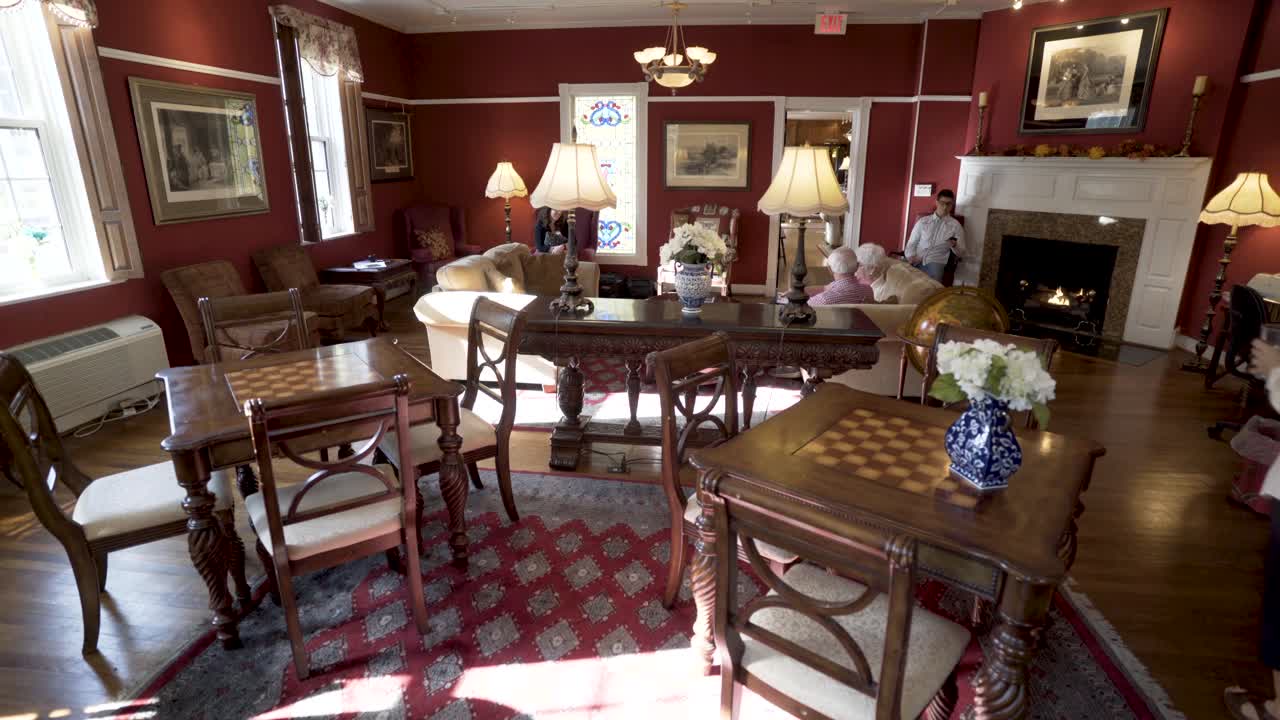 Interior of a Living Room with Chess Tables and Fireplace