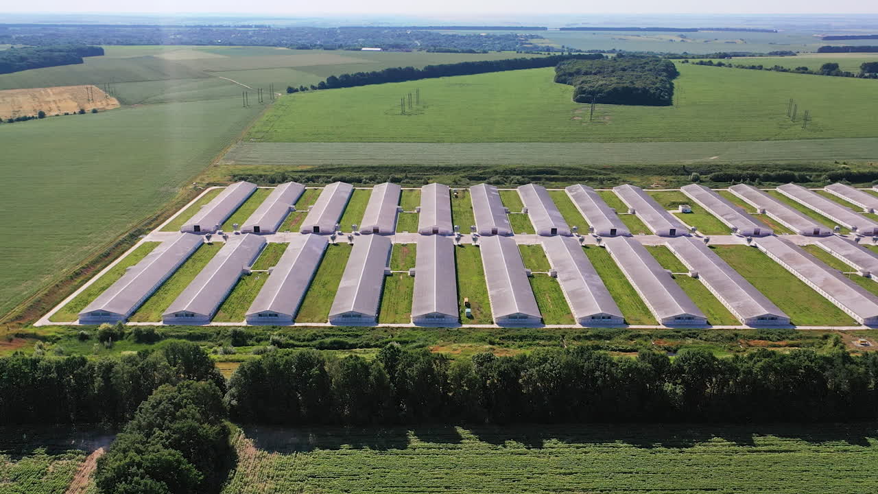 Technology modern countryside farming. Industrial aerial view hangars.