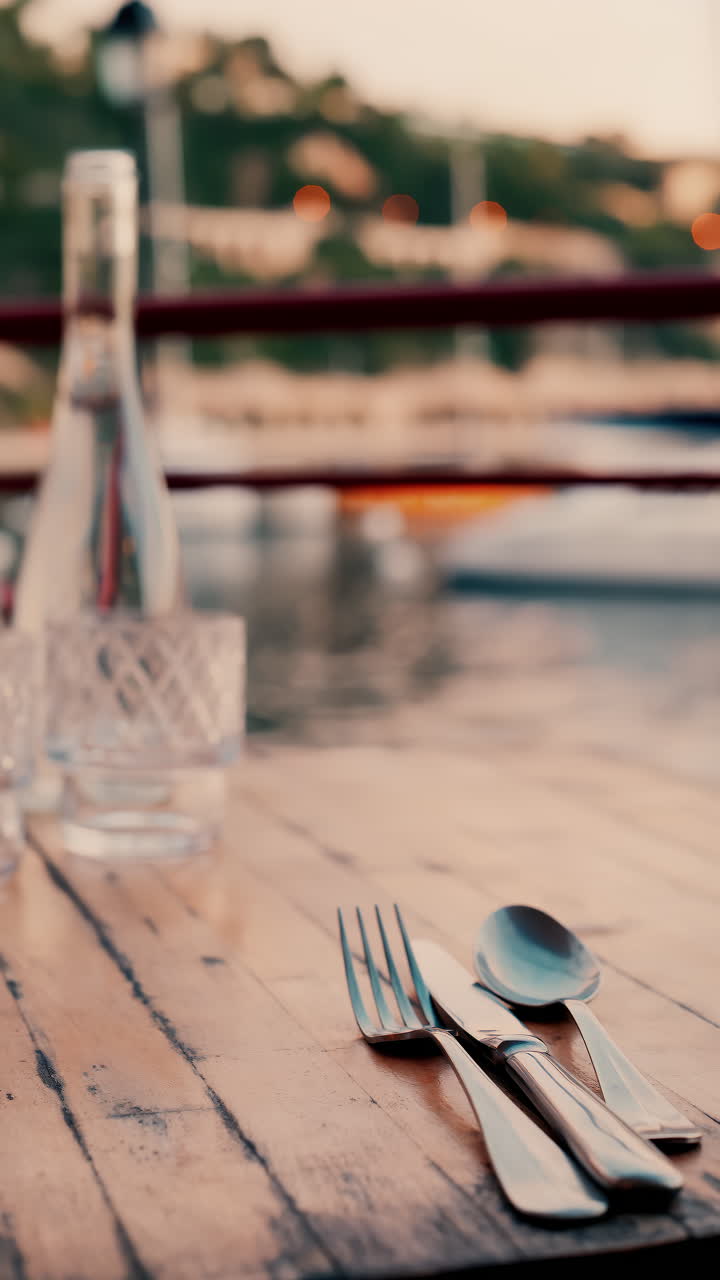 Close up view of a set table and the atmosphere at a restaurant near a port in the south of France