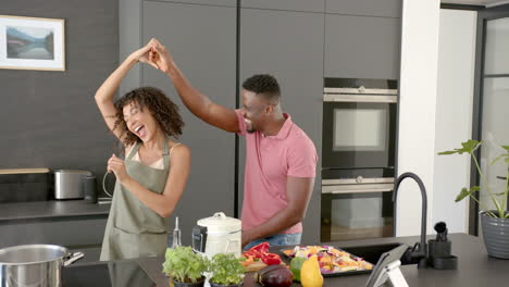 preparing meal with fresh vegetables, happy couple cooking together in modern kitchen