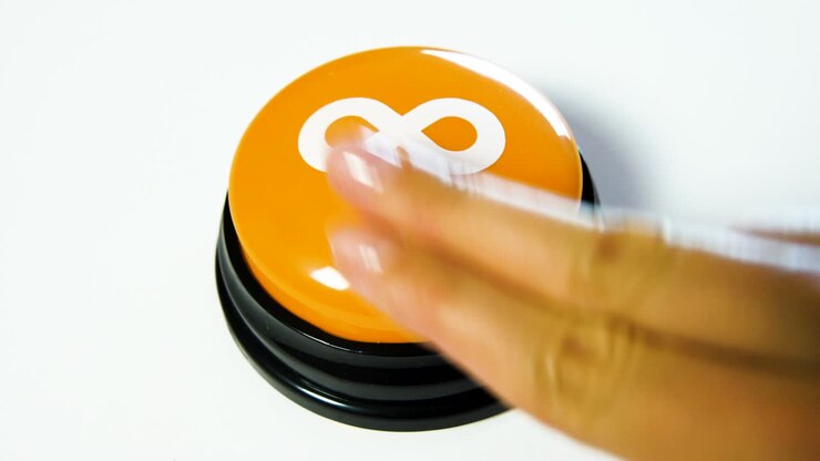 Woman pushing a glossy button with infinity symbol on white background. Mathematical symbol representing an infinitely large number. Concept of getting something for free forever. Lemniscate. No limit