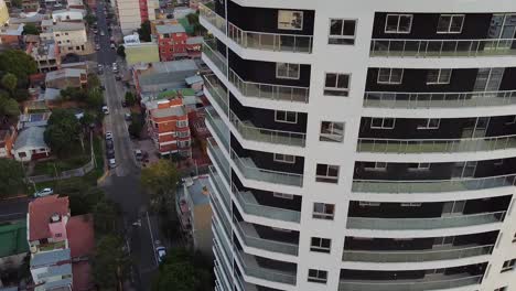 aerial drone shot of large apartment building with a view of the city of posadas, misiones, argentina