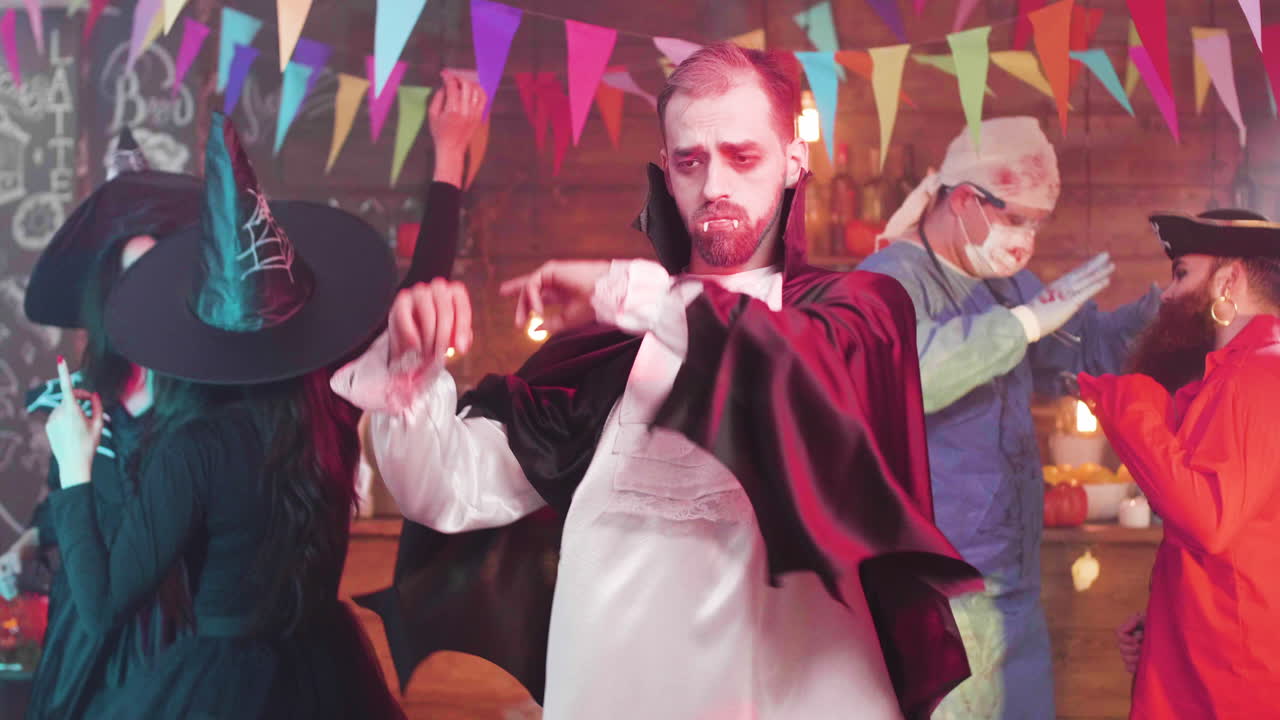 Halloween party with people in various costumes