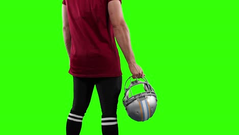 American-Football-Spieler-Auf-Grünem-Hintergrund.