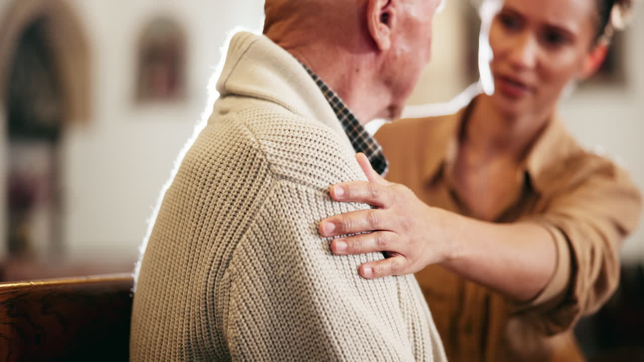 A comforting scene of a woman supporting an elderly person