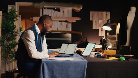 african american tailor checking sketch