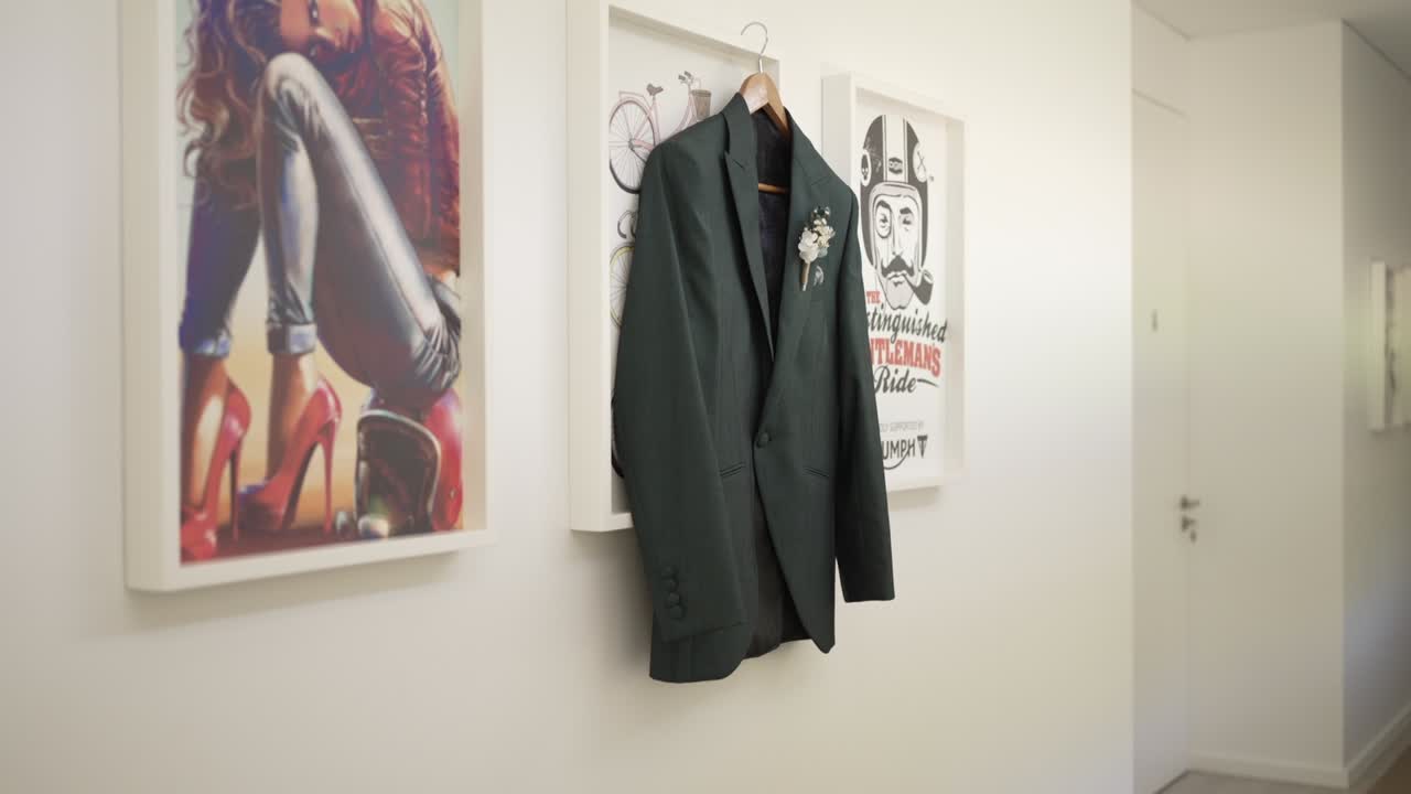 Green Suit Hanging on a Wall in a Modern Home