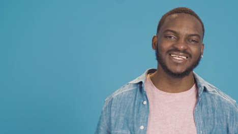 smiling african american fun and happy black man looking at camera.