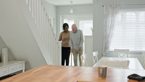 elderly man assisted by caregiver at home