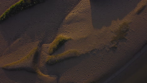 Topdown-Aerial-Drone-Shot-Rising-to-Reveal-Salt-Marsh-at-Sunset-in-North-Norfolk-UK