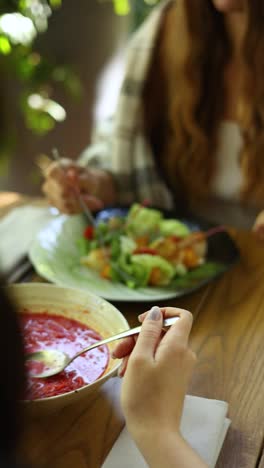 women enjoying a meal outdoors