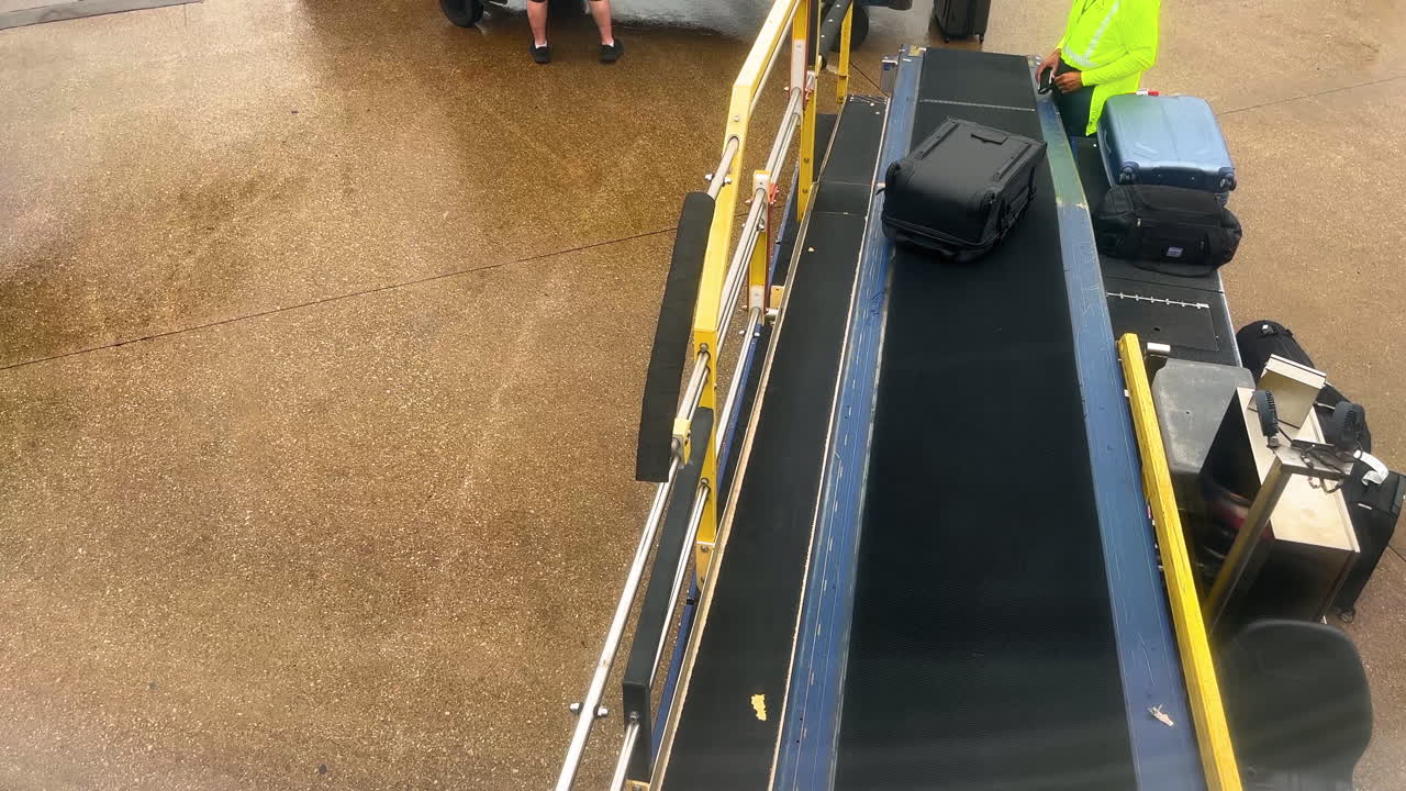 Airport Baggage Handling: Suitcases on Conveyor Belt