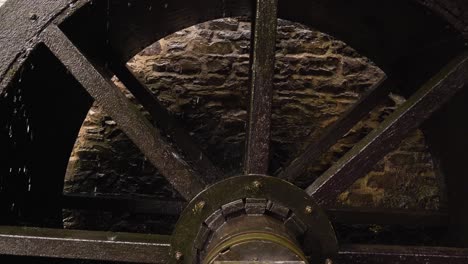 close up on a wooden water wheel from a water mill