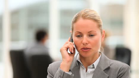 attractive business woman speaking on the phone