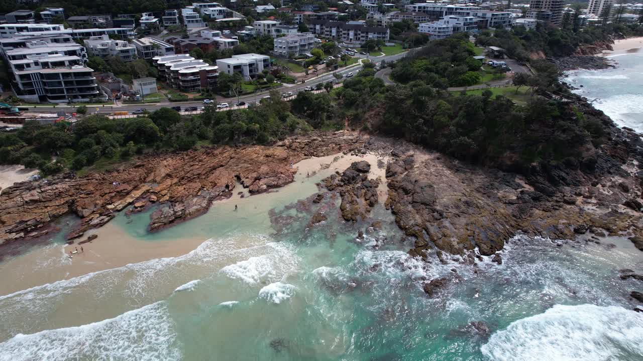 Rocky Coast, Waves, And Beach By Coolum Beachside Town In Sunshine Coast, QLD, Australia. - aerial shot