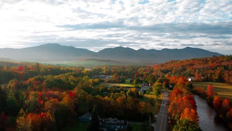 backwards hyperlapse during sunrise over a autumn colored nature in new england