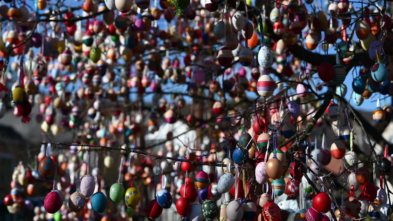 Close-up of a decorated Easter egg tree with colorful ornaments