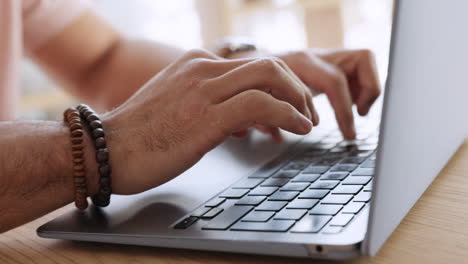 man with laptop writing email