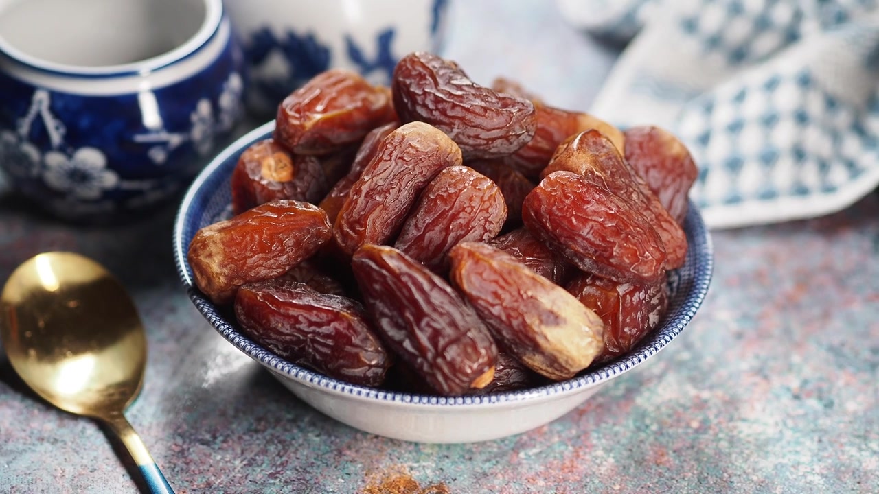 Bowl of Sweet Dried Dates on a Table