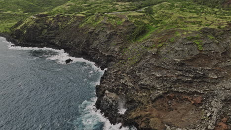 Maui-Hawaii-Aerial-v18-birds-eye-view-drone-flyover-and-around-Nakalele-Blowhole-capturing-coastal-landscape-of-rugged-volcanic-terrain-and-ocean-waves---Shot-with-Mavic-3-Cine---December-2022