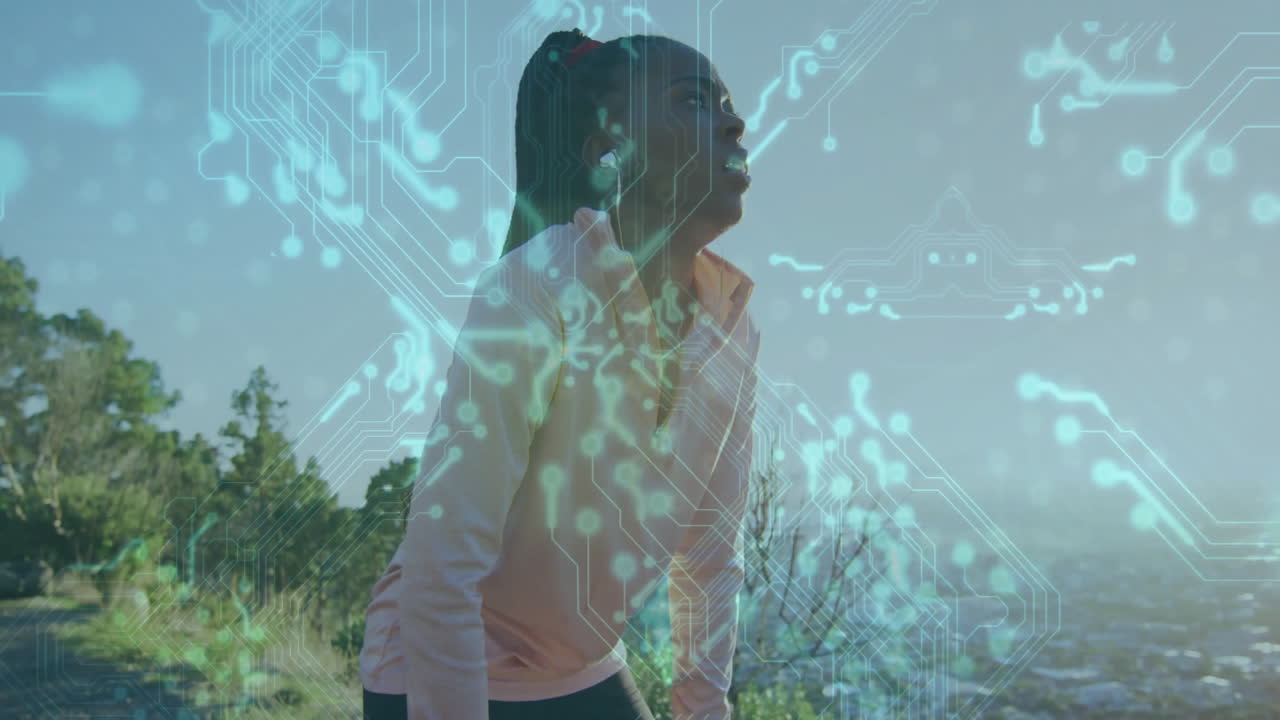 woman wearing wireless earbuds leaning on dirt trail showing digital overlay for fitness technology