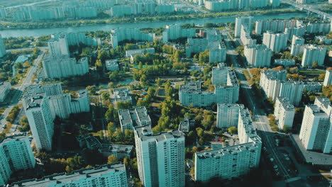 aerial view of a city with apartment buildings and river