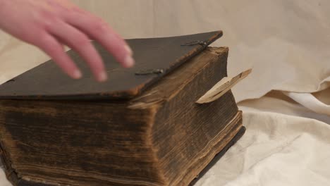 closing old historical bible, slider shot, close up