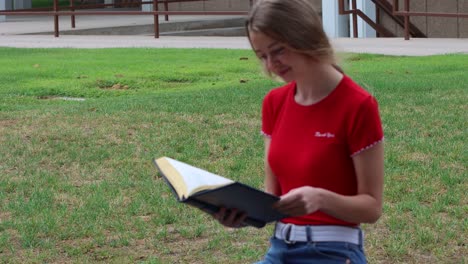 reading in the campus commons a young woman studies the classics