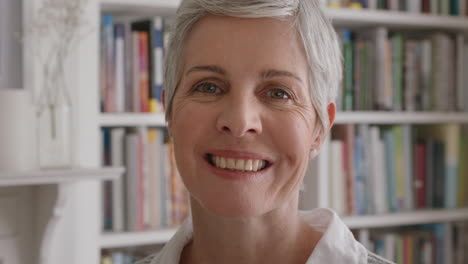 portrait-happy-middle-aged-woman-smiling-confident-senior-female-enjoying-successful-retirement-feeling-positive-at-home-4k-footage