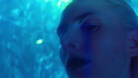 Woman with Creative Alien Makeup Posing in Laser Beams