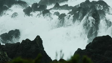 Dramatic-stormy-sea-water-crashing-over-rocks