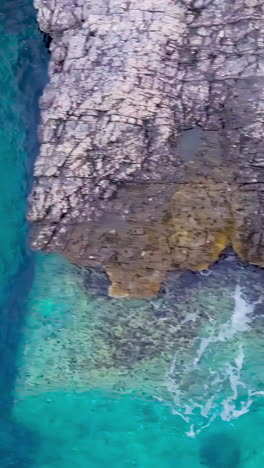 coastal caves and cliffs with turquoise water