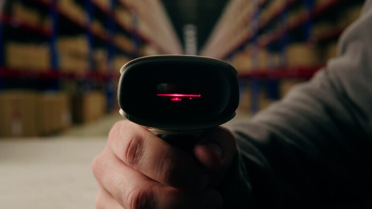 Scanner scan delivery box in storage, E-commerce shop, man packing goods and clothes second hand delivery market, courier Packaging and Shipping Workspace with Supplies and Technology, online sales.