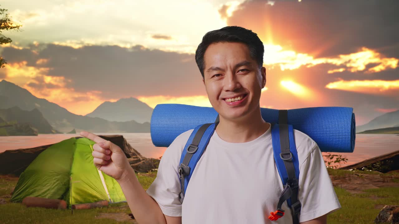 Happy Camper Points to Tent at Sunset