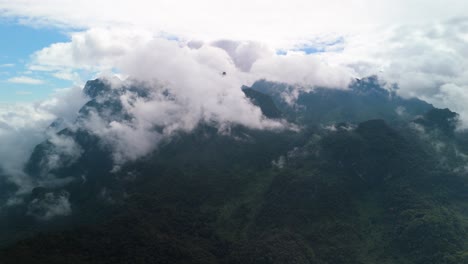 doi luang chiang dao covered in clouds, highest mountain in thailand national park, jungle lush green forest mountain peak