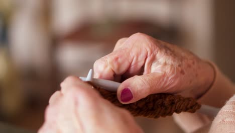 close-up of hands knitting