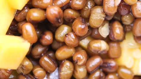 close-up of cooked sweet beans with yellow fruit