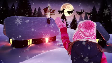 little girl waving to santa flying over village