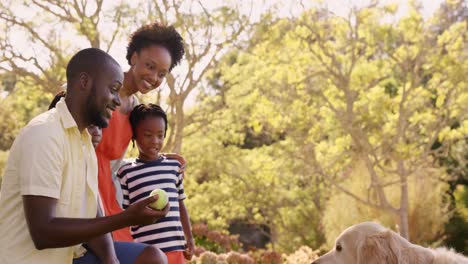 Cute-family-is-playing-with-a-dog-in-the-park