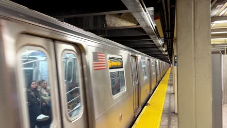 train arriving on 57 street metro station of new york city subway usa