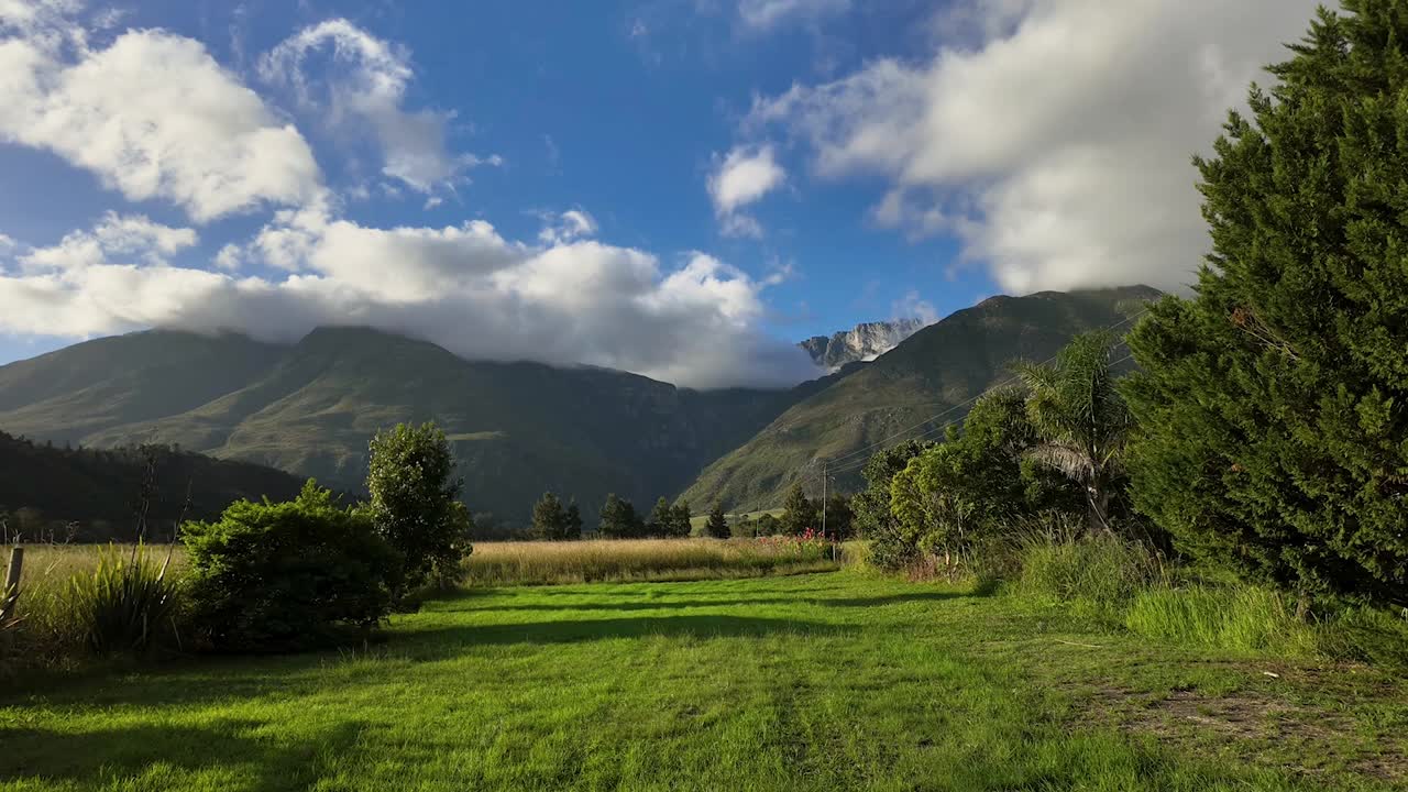 Scenic view of a farm in Swellendam, South Africa, with mountains in the background.